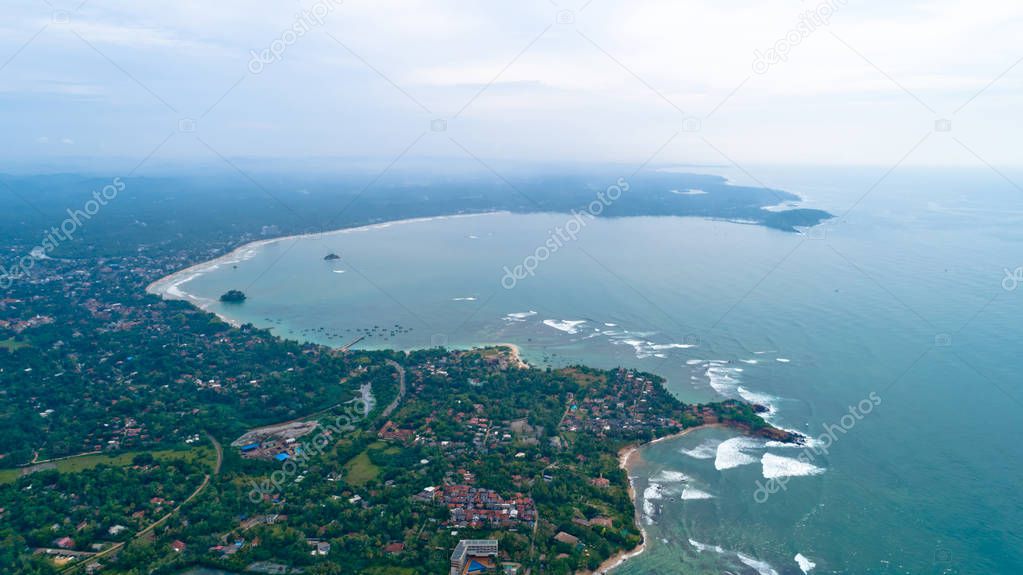 Aerail view of beautiful seascape with fishermen village in the coast