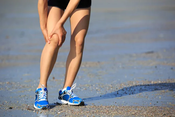 Woman Runner Holding Her Sports Injured Knee — Stock Photo, Image