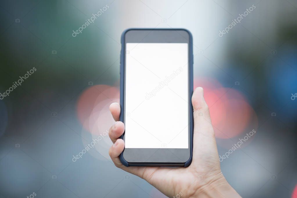 cropped view of person using cellphone in city