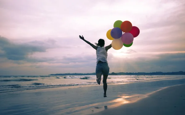 Young Asian Woman Running Jumping Seaside Colored Balloons — 스톡 사진