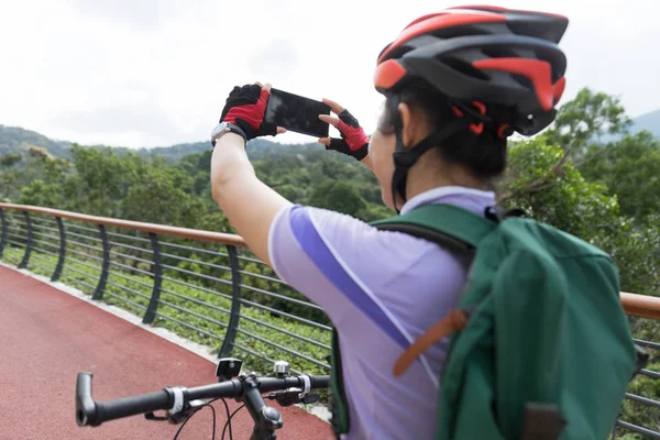 Woman Using Smartphone Taking Photo While Bike Ride Spring Forest — Stock Photo, Image