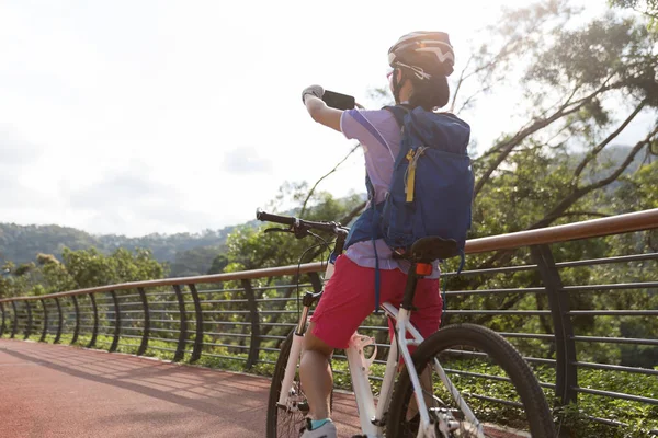 Cyclist Using Smartphone Taking Photo While Bike Ride Spring Forest — Stock Photo, Image