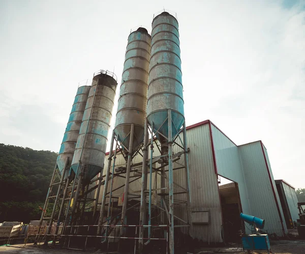 Exterior view of a cement factory. Concrete mixing silo, construction site facilities