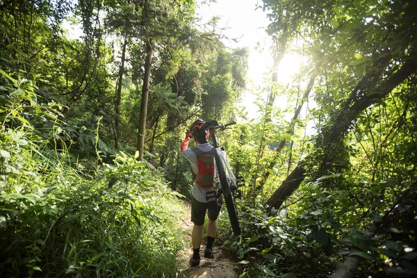 Woman Cyclist Carrying Mountain Bike Walking Tropical Forest Trail — Stock Photo, Image