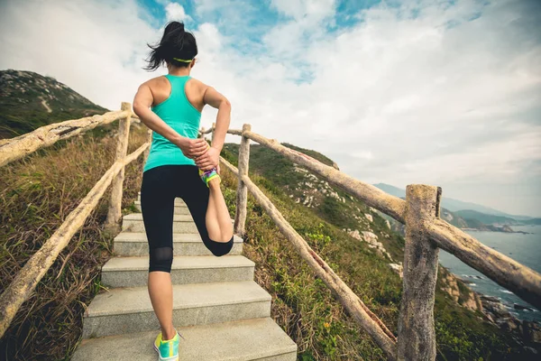 Young Fitness Woman Runner Stretching Legs Mountain Trail — Stock Photo, Image