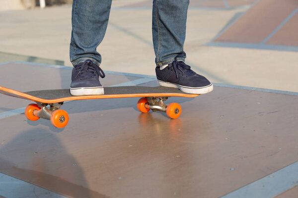 Skateboarding on skatepark ramp in city