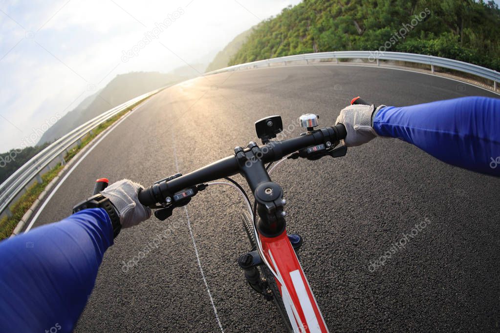 Cyclist riding a bike on highway