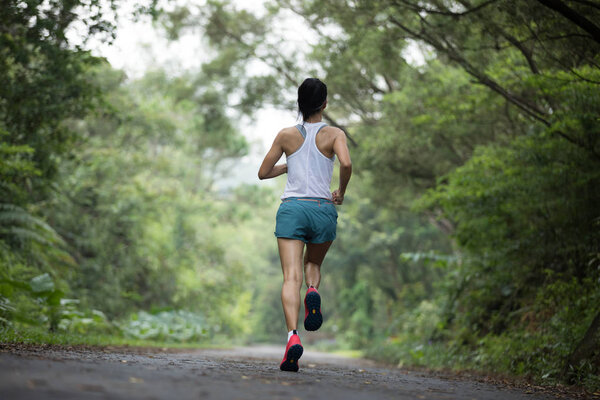 Healthy fitness woman jogging outdoors.