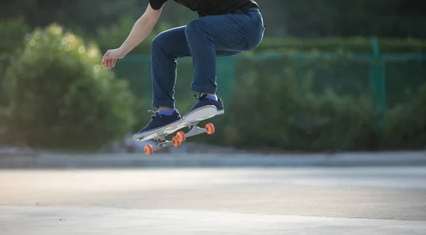 Skateboarder skateboarding at morning outdoors and doing tricks