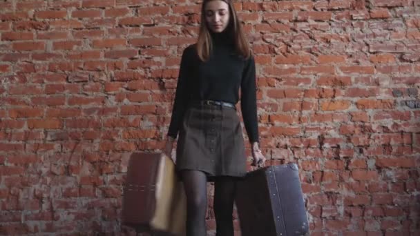 Young Girl Suitcases Her Hands Background Red Brick — Stock Video