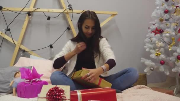 Girl Looks Gifts Rejoices Birthday New Year Christmas Holiday — Stock Video