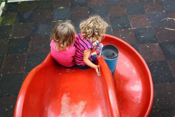 Two Pretty Girls Playing Together Red Slope Playground — Stock Photo, Image