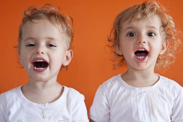 Two sisters making faces