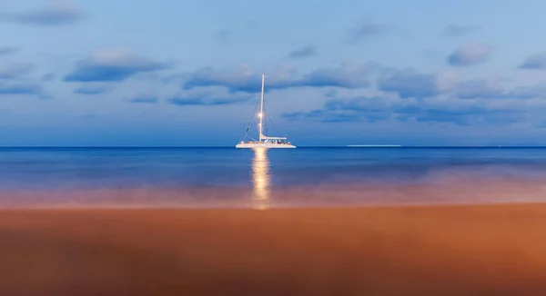 Lonely yacht floating by sea in evening