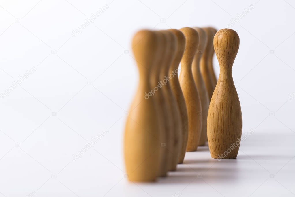 wooden figure stands out from the crowd. Business leadership concept