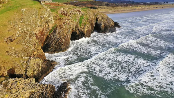 Aerial view of cliffs and ocean at Black Rock sands in Gwynedd, North Wales