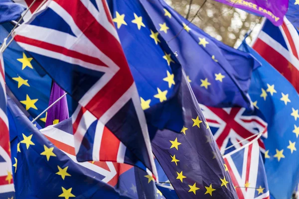 European Union and British Union Jack flag flying together. A symbol of the Brexit EU referendum