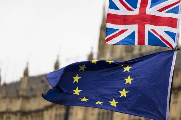 European Union and British Union Jack flag flying together. A symbol of the Brexit EU referendum