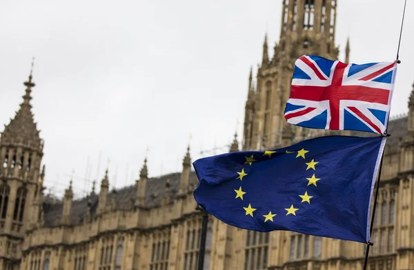 European Union and British Union Jack flag flying together. A symbol of the Brexit EU referendum