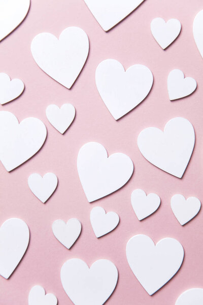White hearts on a pastel pink background. Valentine's day, Mother's day background