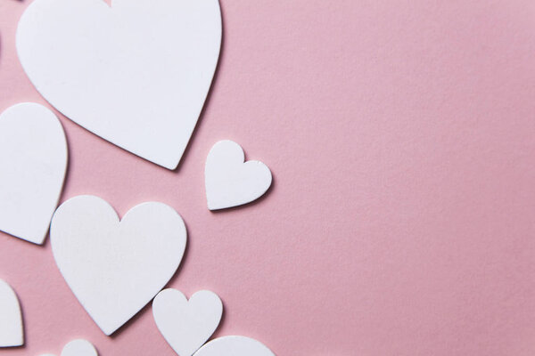 White hearts on a pastel pink background. Valentine's day, Mother's day background