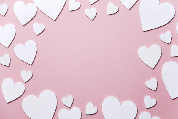 White hearts on a pastel pink background. Valentine's day, Mother's day background