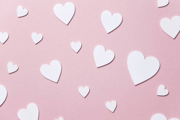 White hearts on a pastel pink background. Valentine's day, Mother's day background