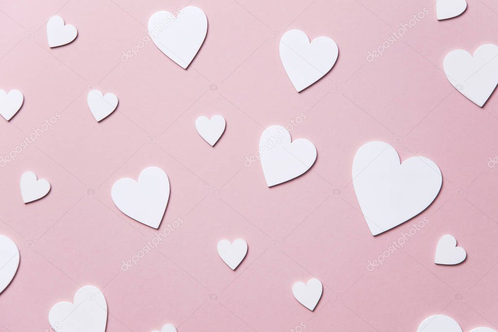 White hearts on a pastel pink background. Valentine's day, Mother's day background