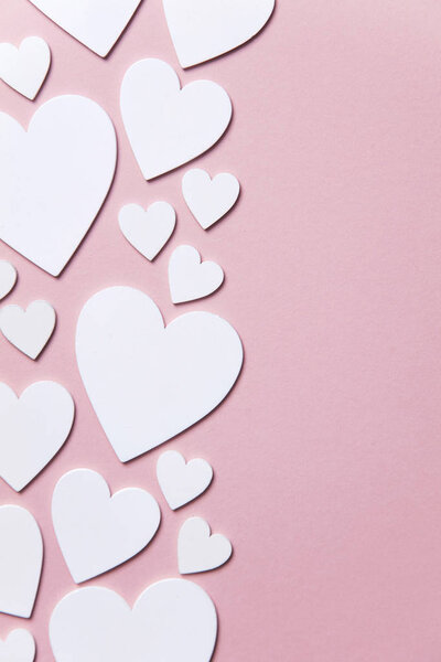 White hearts on a pastel pink background. Valentine's day, Mother's day background