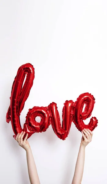 Red Foil Love Balloon Held Plain White Background — Stock Photo, Image