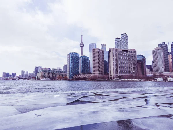 View of Toronto city skyline form a boat as it crosses the frozen Lake Ontario — Stock Photo, Image