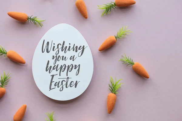 Easter message background with easter eggs and carrots Royalty Free Stock Photos