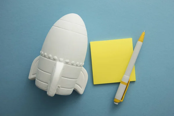 Business Launch. Rocket ship with notepad. Business development concept