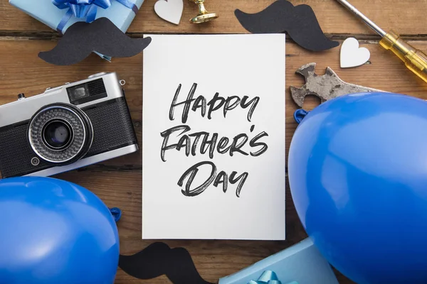 Happy Fathers day card composition with gifts, mustache, trophy, camera — Stock Photo, Image