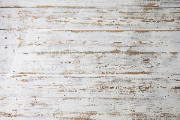 White wooden floorboards. Distressed worn floorboard background painted white