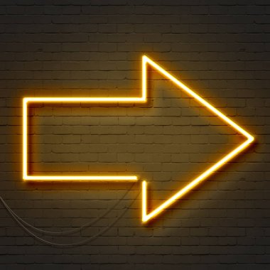 Tuğla duvarda sarı neon ok işareti