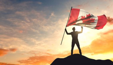 Canada flag being waved by a man celebrating success at the top  clipart