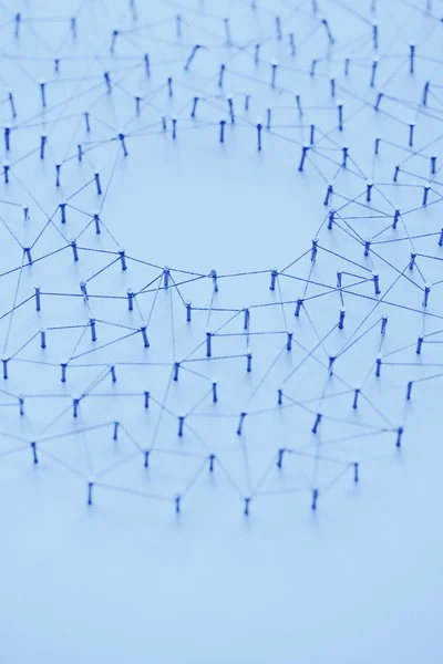 A large grid of pins connected with string. Communication, techn
