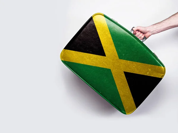 Jamaica-Flagge auf einem alten Lederkoffer. — Stockfoto