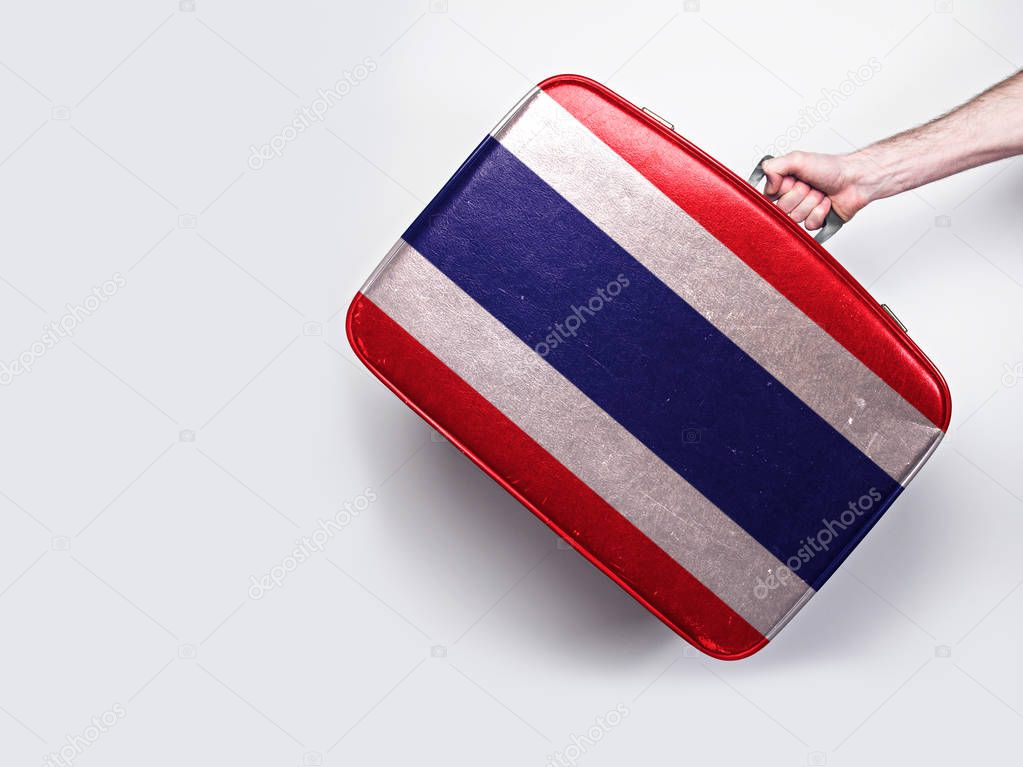 Thailand flag on a vintage leather suitcase.