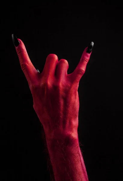 Rosso diavolo mano rendendo diavolo corno segno mano — Foto Stock