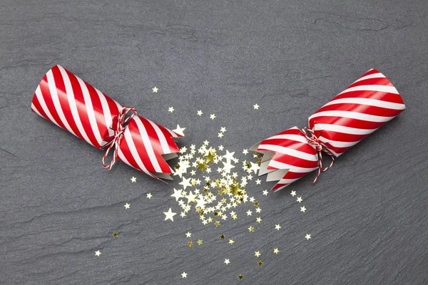 Christmas crackers on a slate background crackers