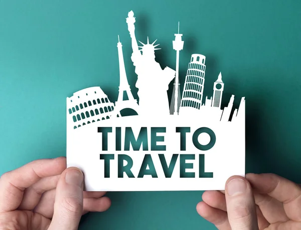 Time to travel paper cut out shape with famous city travel desti