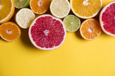 Sarı bir arka plan müziği narenciye fuits, greyfurt, limon, kireç, turuncu