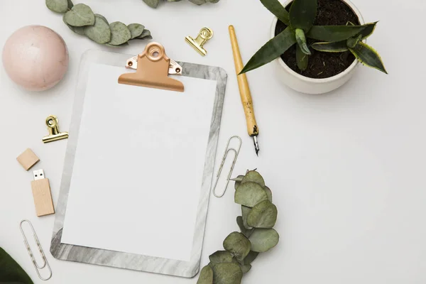 Clipboard with blank paper and accessories mockup, top view — Stock Photo, Image