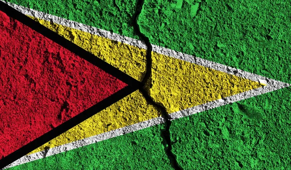 Bandera de Guyana con grieta en el medio. Conce dividido por países —  Fotos de Stock