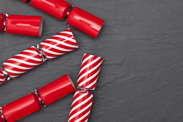 Christmas crackers on a slate background crackers