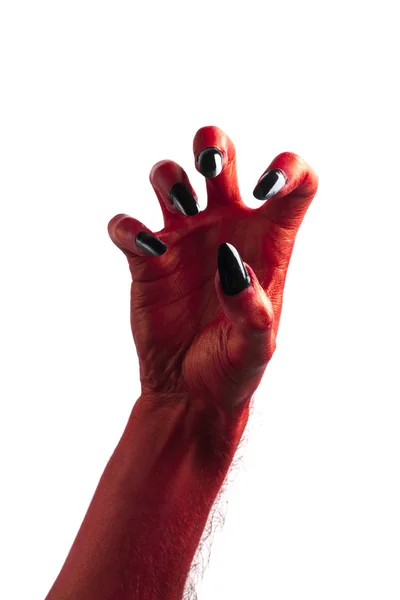 Halloween rote Teufelsmonster Hand mit schwarzen Fingernägeln gegen — Stockfoto