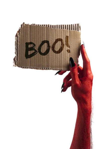 ¡Boo! diablo rojo o zombi monstruo mano sosteniendo un signo de halloween —  Fotos de Stock