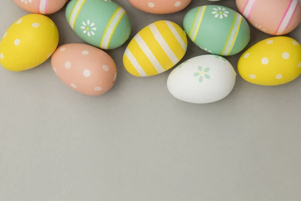 Easter holiday background. Pastel coloured decorated easter eggs